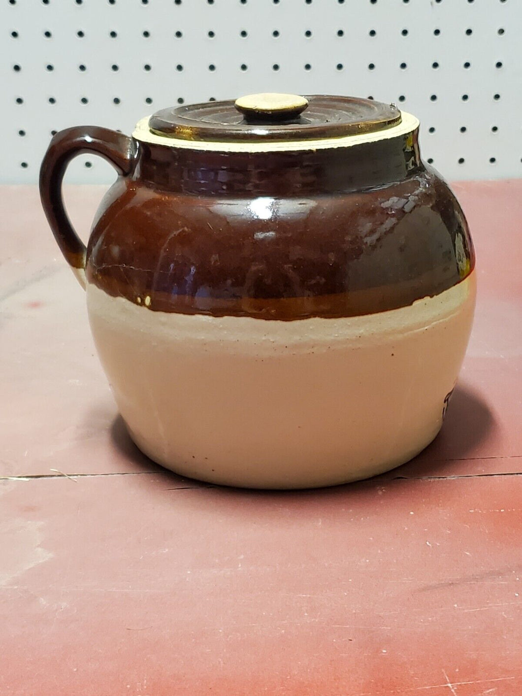 Small brown crock with lid